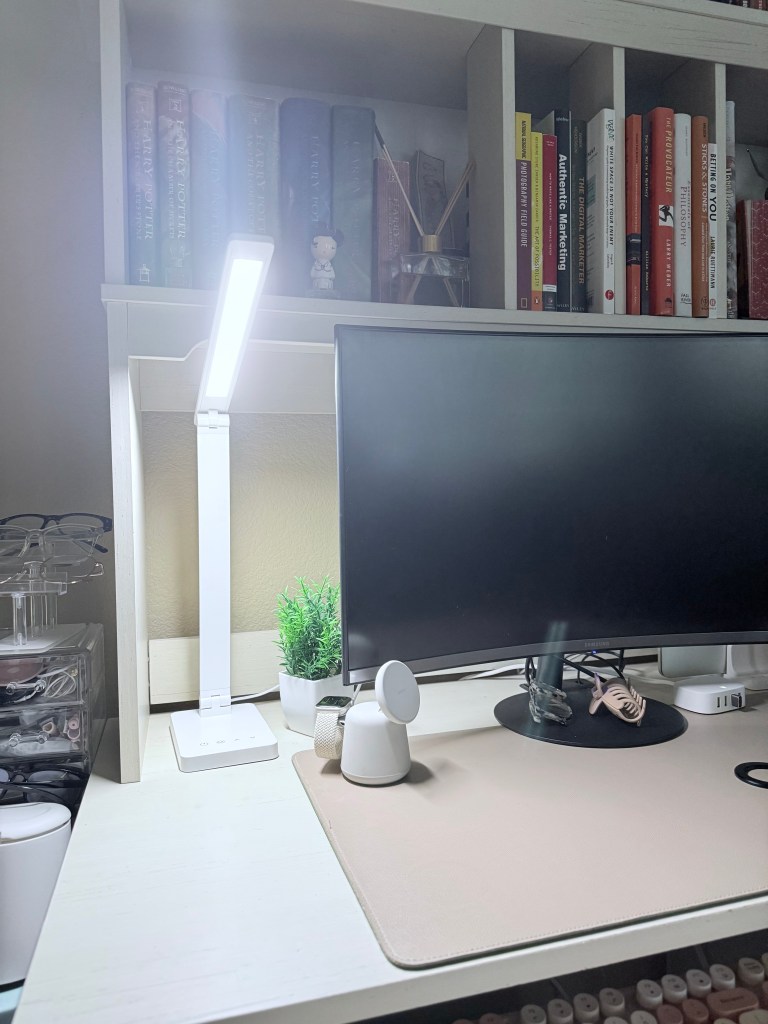 image of the Lepro touch desk lamp, a small potted plant and the Belkin 2-1 charger that's magsafe.  All that is next to a curved monitor.